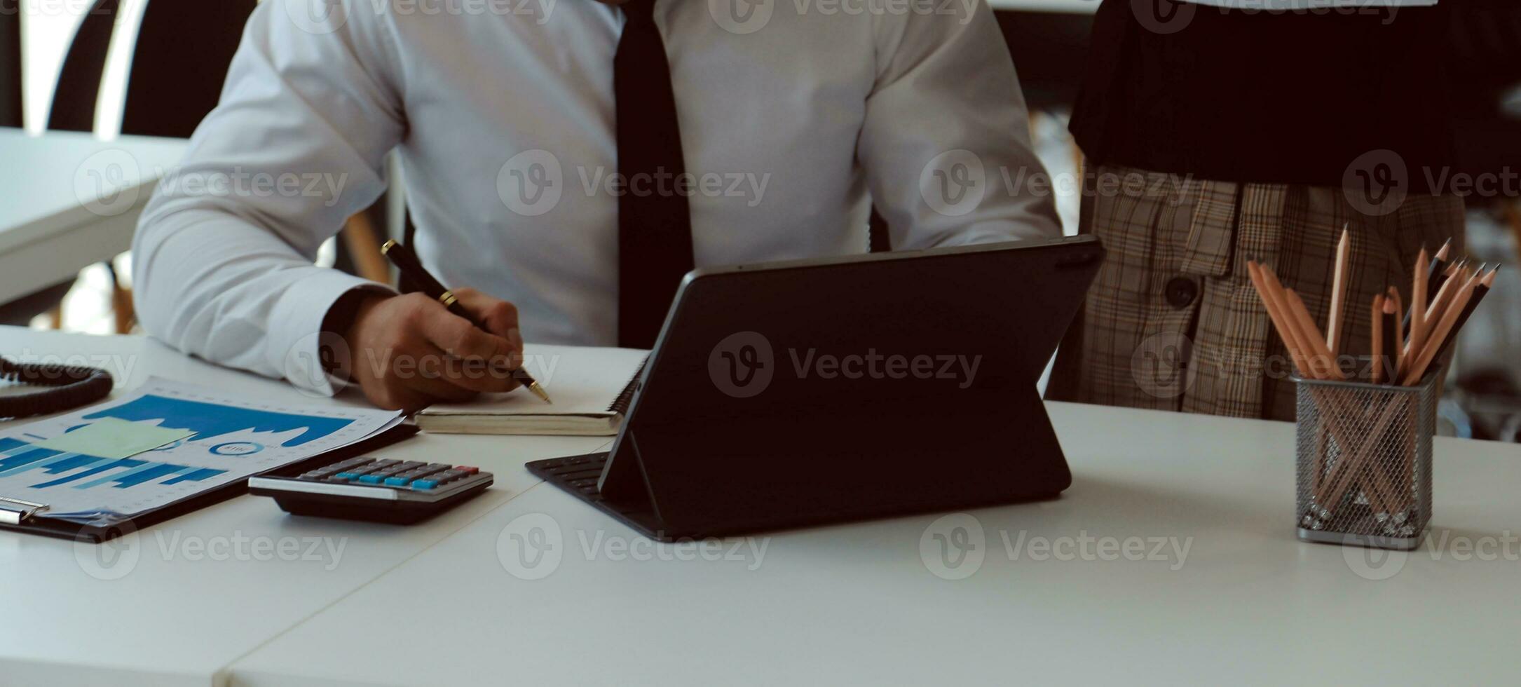 Close up of Business team analyzing income charts and graphs with modern laptop computer. Business analysis and strategy concept. photo