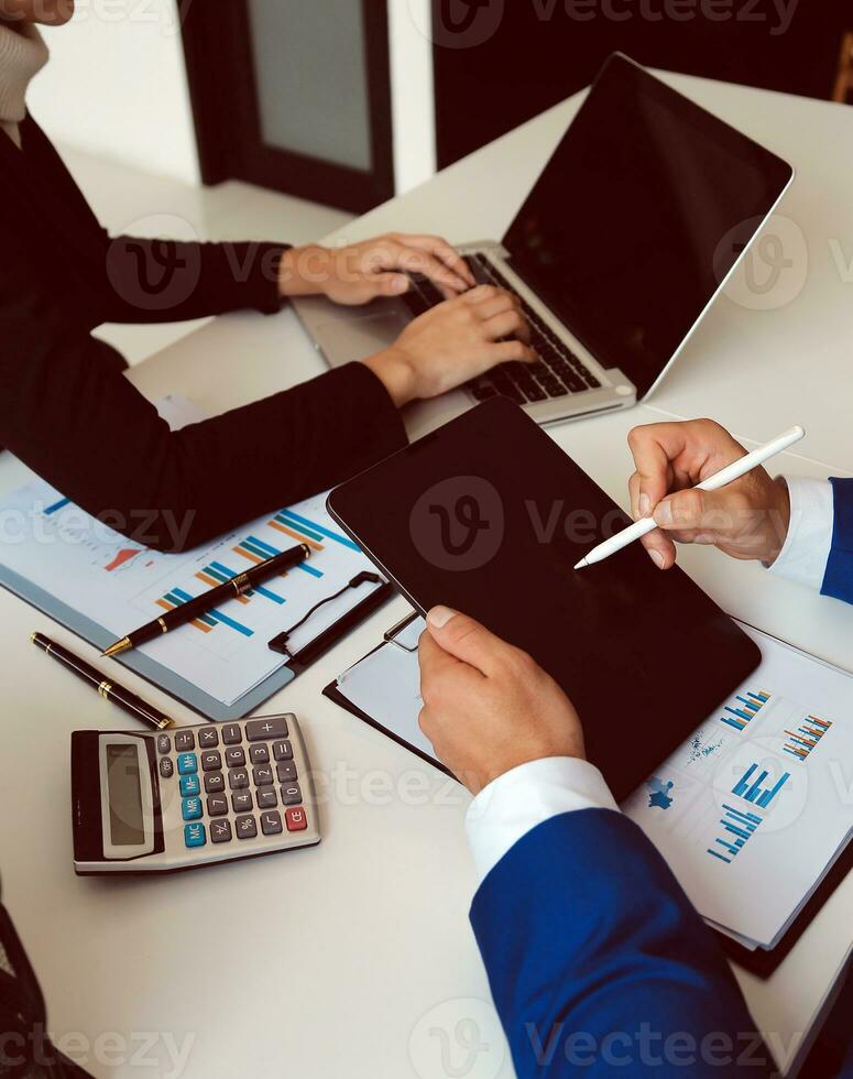 Close up of Business team analyzing income charts and graphs with modern laptop computer. Business analysis and strategy concept. photo