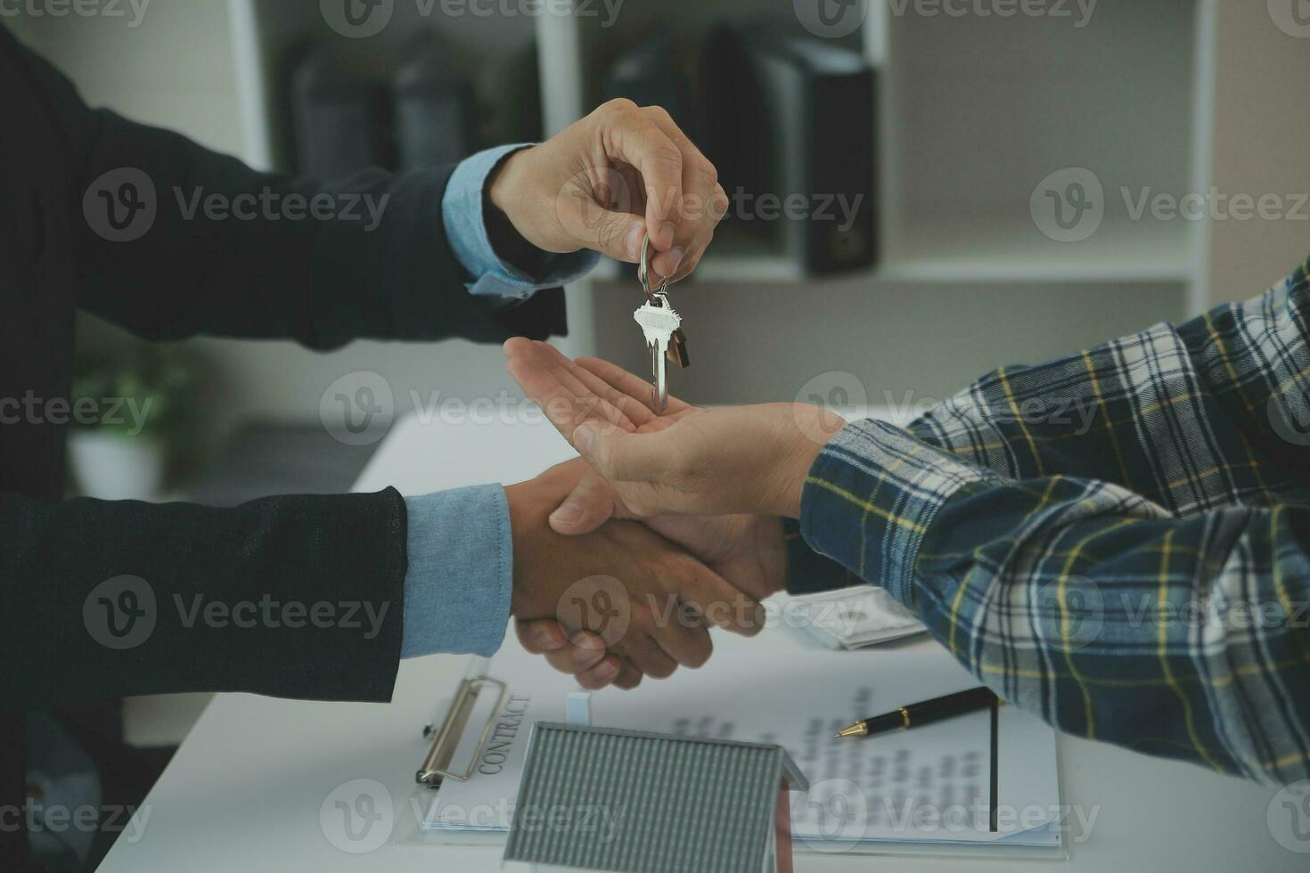 Real estate agent and customer signing contract to buy house, insurance or loan real estate.rent a house,get insurance or loan real estate or property. photo