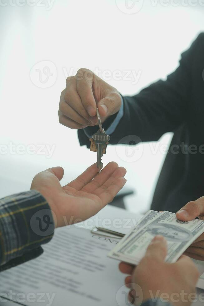 Real estate agent and customer signing contract to buy house, insurance or loan real estate.rent a house,get insurance or loan real estate or property. photo