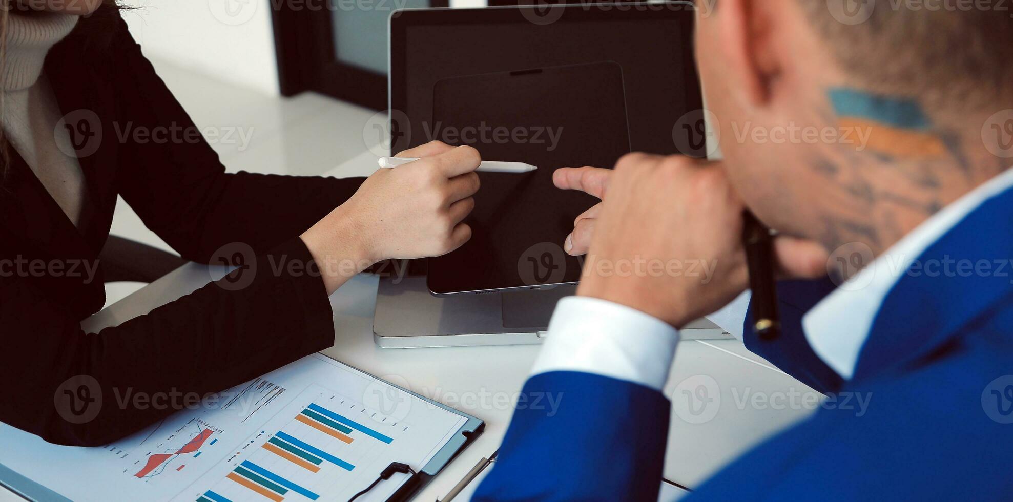 Close up of Business team analyzing income charts and graphs with modern laptop computer. Business analysis and strategy concept. photo