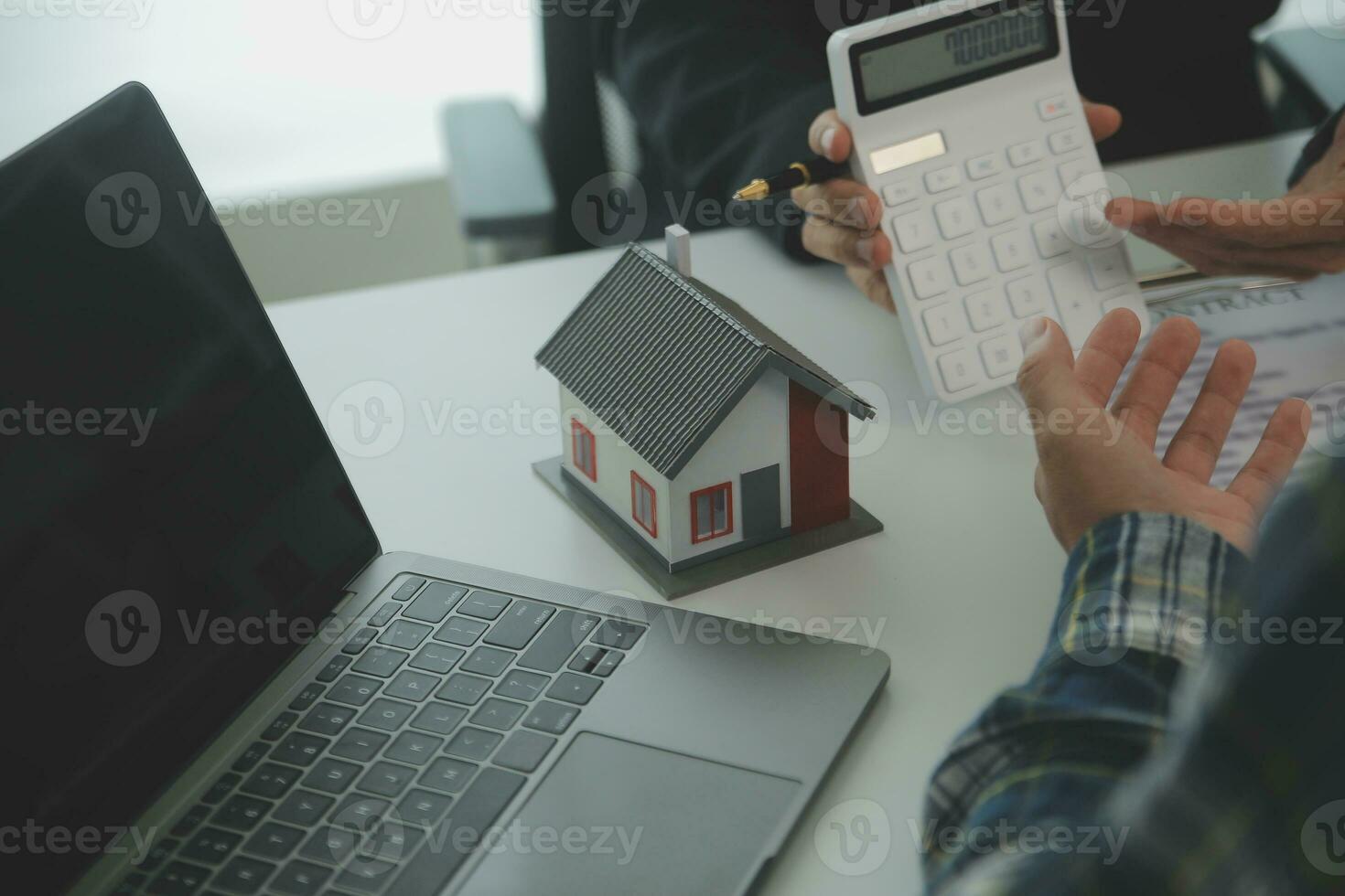 Real estate agent and customer signing contract to buy house, insurance or loan real estate.rent a house,get insurance or loan real estate or property. photo
