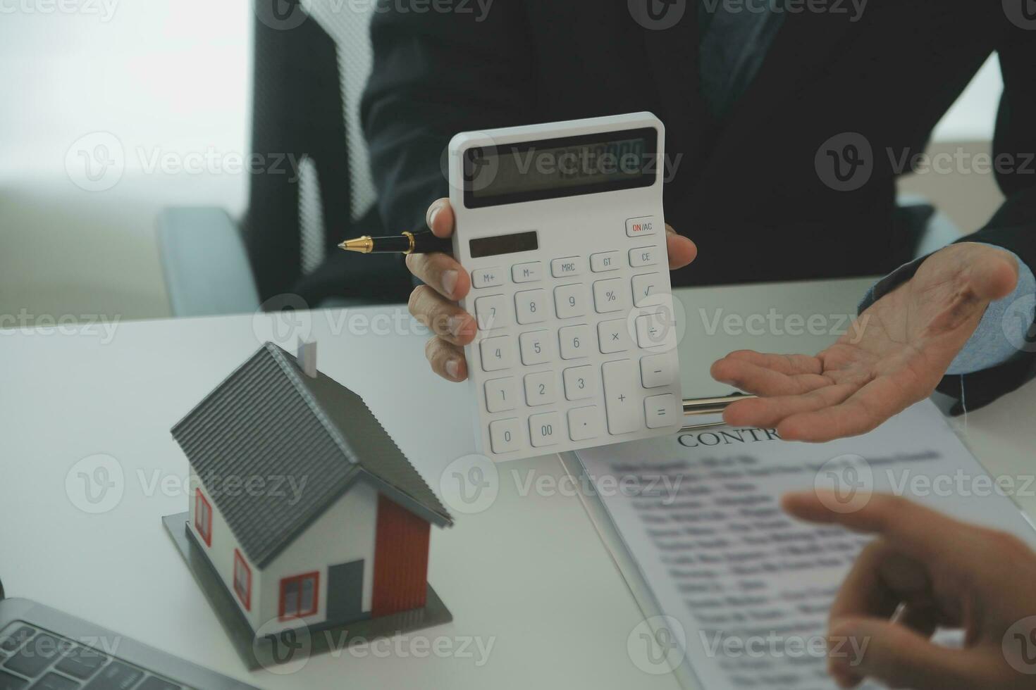 Real estate agent and customer signing contract to buy house, insurance or loan real estate.rent a house,get insurance or loan real estate or property. photo