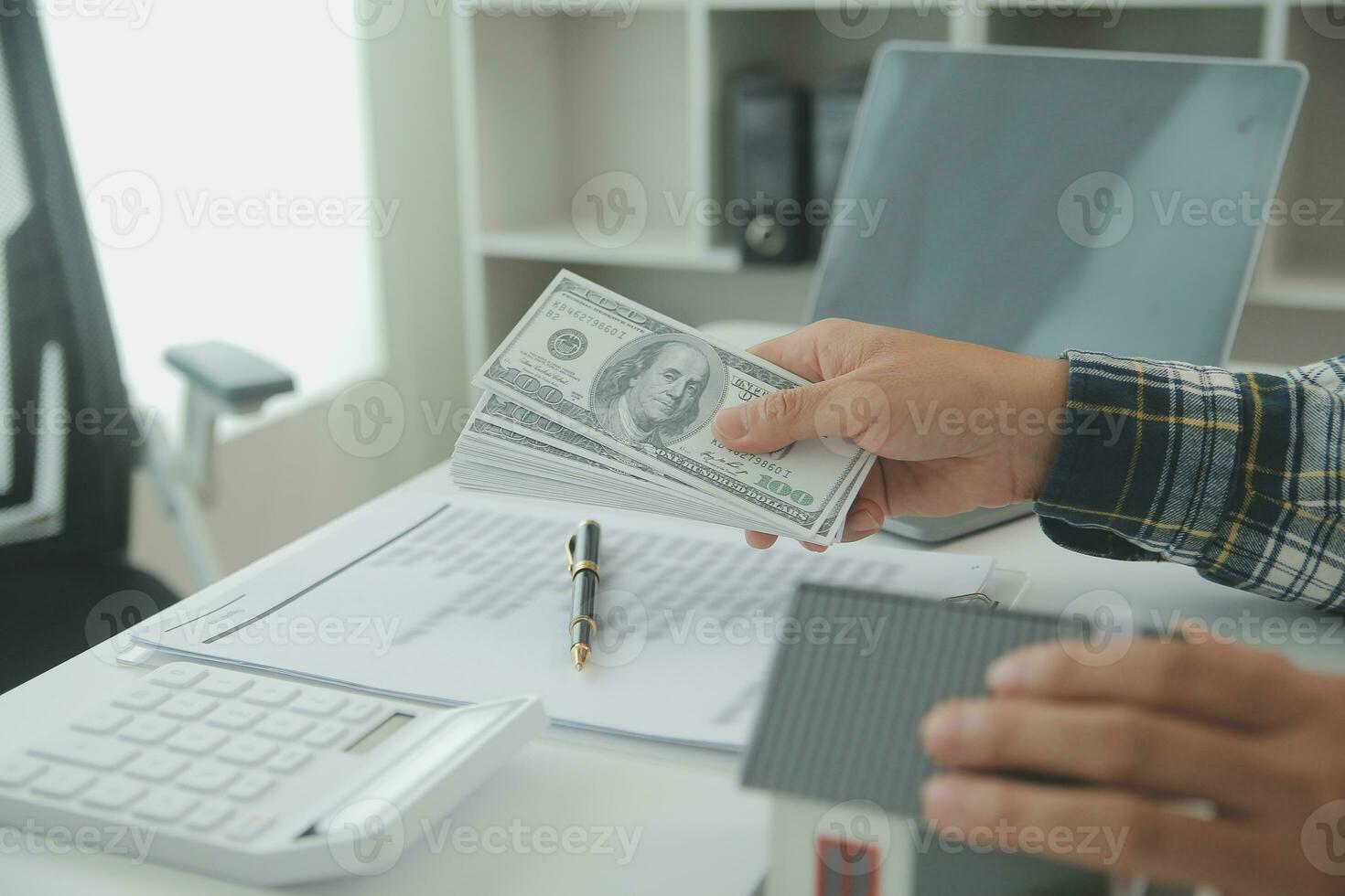Real estate agent and customer signing contract to buy house, insurance or loan real estate.rent a house,get insurance or loan real estate or property. photo