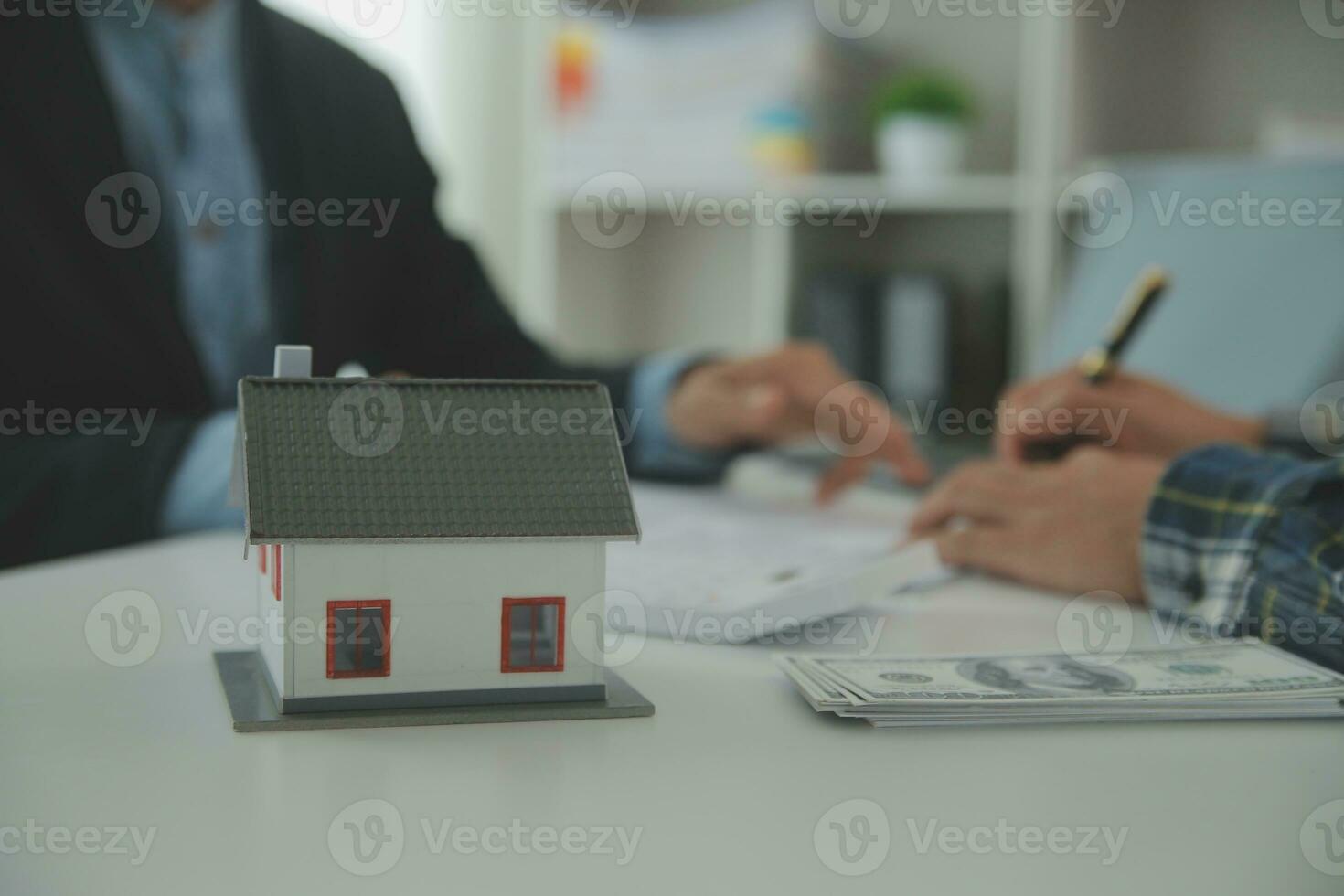 Real estate agent and customer signing contract to buy house, insurance or loan real estate.rent a house,get insurance or loan real estate or property. photo