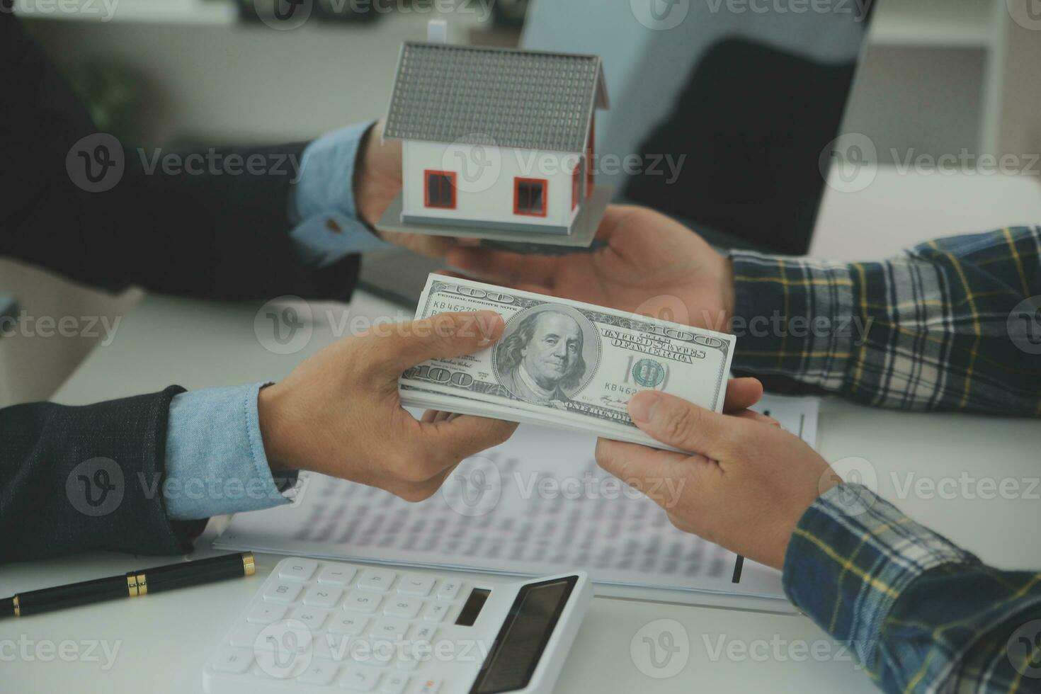 Real estate agent and customer signing contract to buy house, insurance or loan real estate.rent a house,get insurance or loan real estate or property. photo