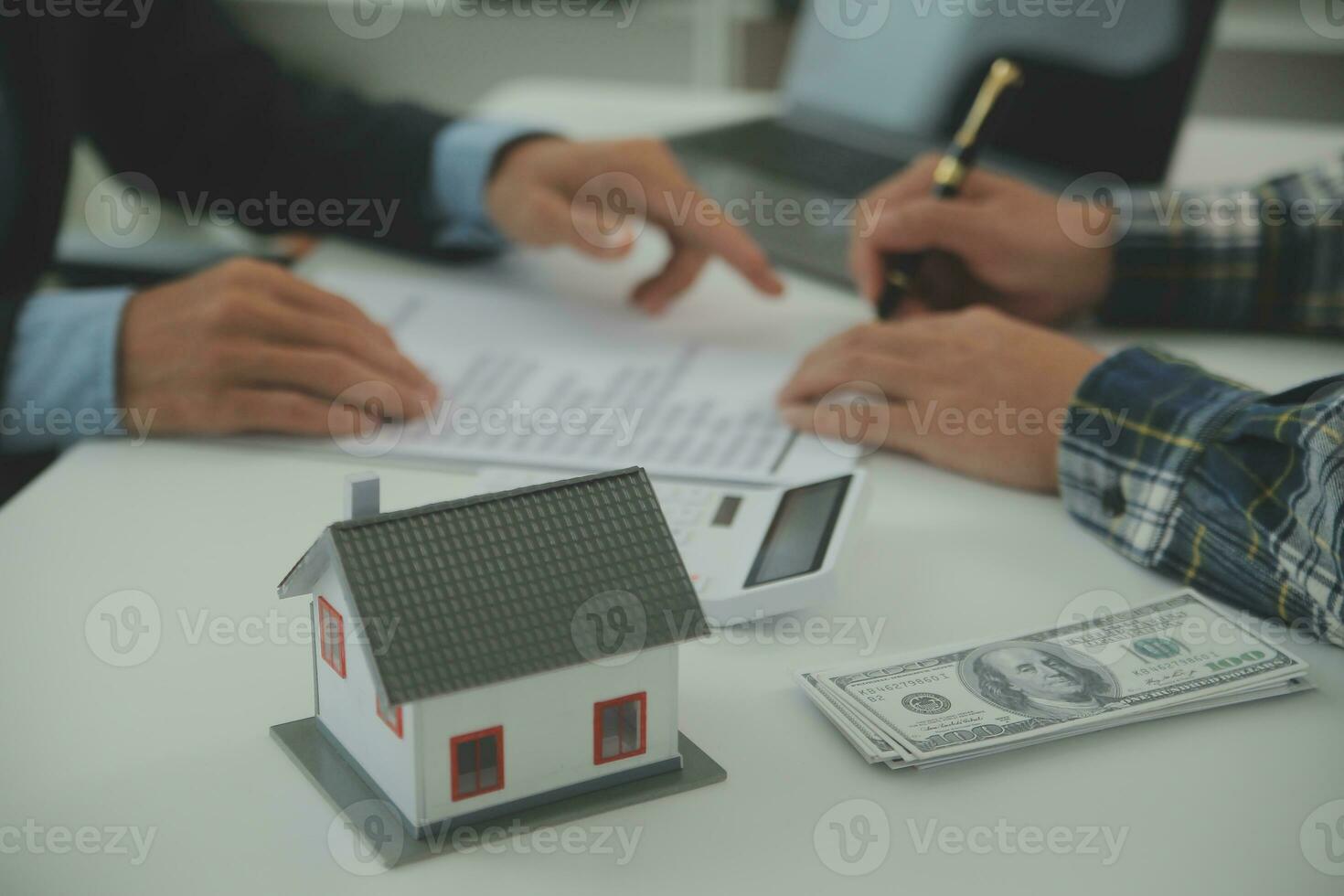 Real estate agent and customer signing contract to buy house, insurance or loan real estate.rent a house,get insurance or loan real estate or property. photo