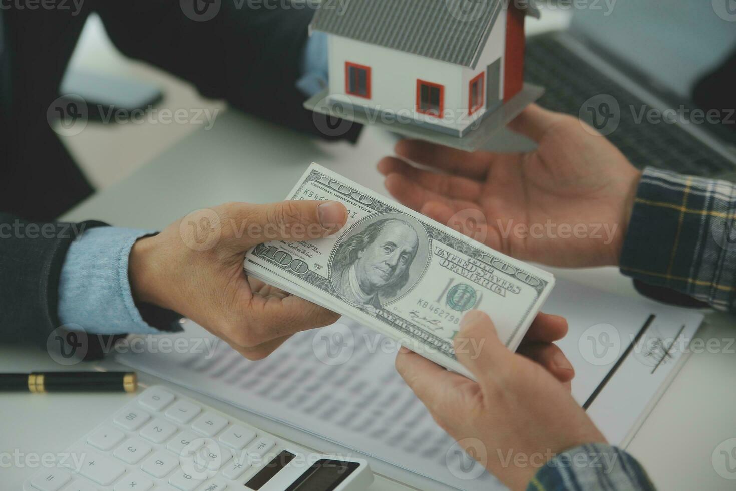 Real estate agent and customer signing contract to buy house, insurance or loan real estate.rent a house,get insurance or loan real estate or property. photo