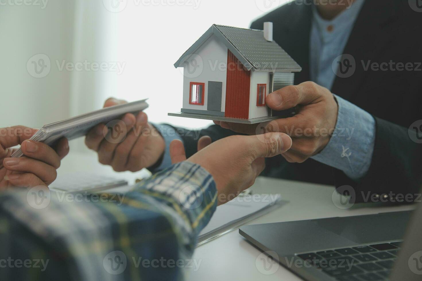 Real estate agent and customer signing contract to buy house, insurance or loan real estate.rent a house,get insurance or loan real estate or property. photo