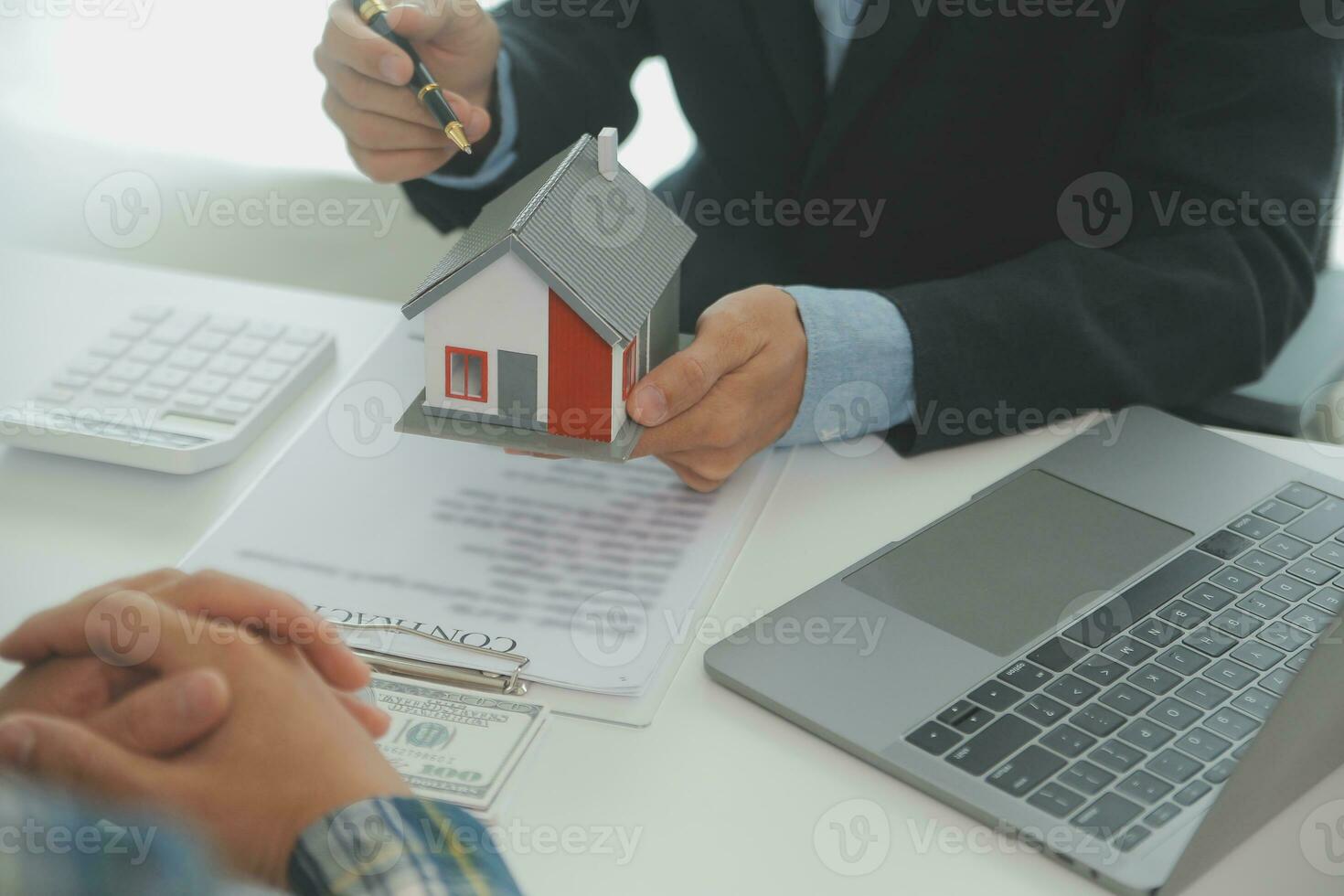 Real estate agent and customer signing contract to buy house, insurance or loan real estate.rent a house,get insurance or loan real estate or property. photo