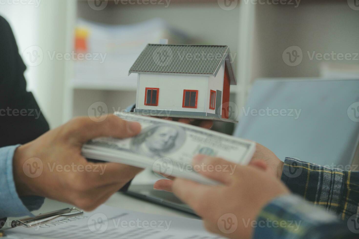 Real estate agent and customer signing contract to buy house, insurance or loan real estate.rent a house,get insurance or loan real estate or property. photo