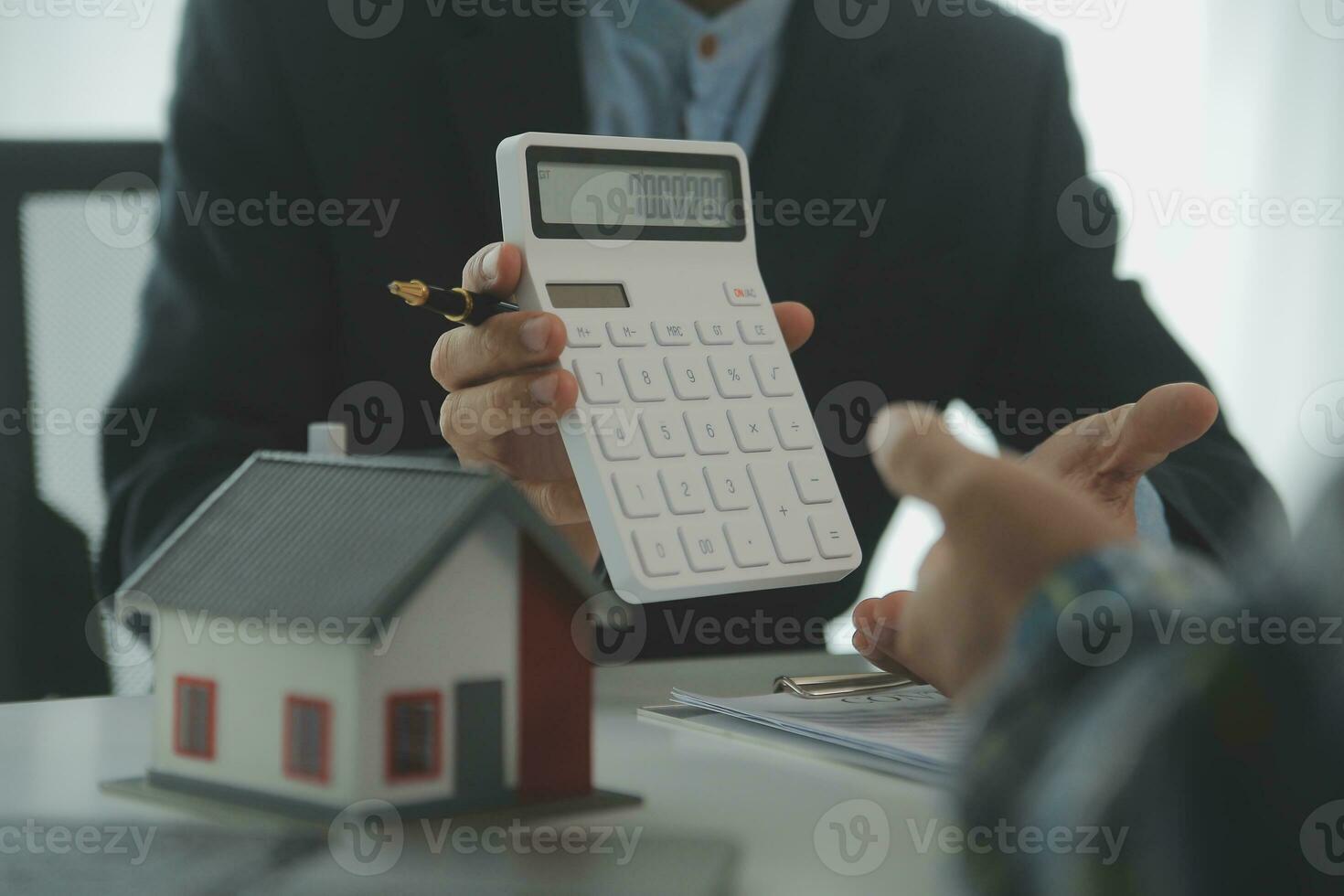 Real estate agent and customer signing contract to buy house, insurance or loan real estate.rent a house,get insurance or loan real estate or property. photo