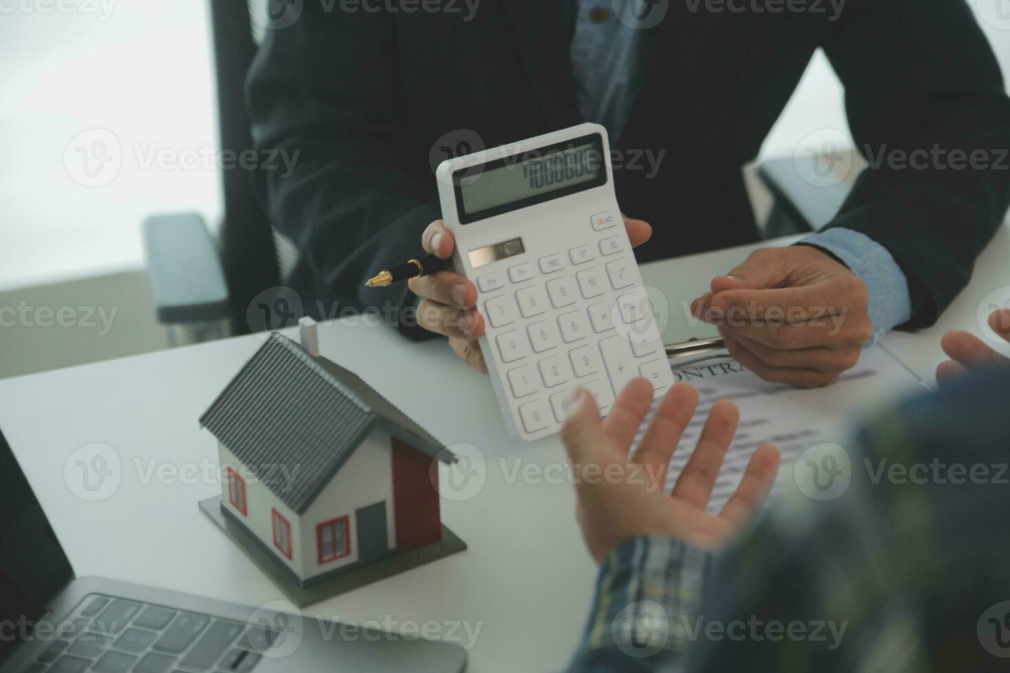 Real estate agent and customer signing contract to buy house, insurance or loan real estate.rent a house,get insurance or loan real estate or property. photo