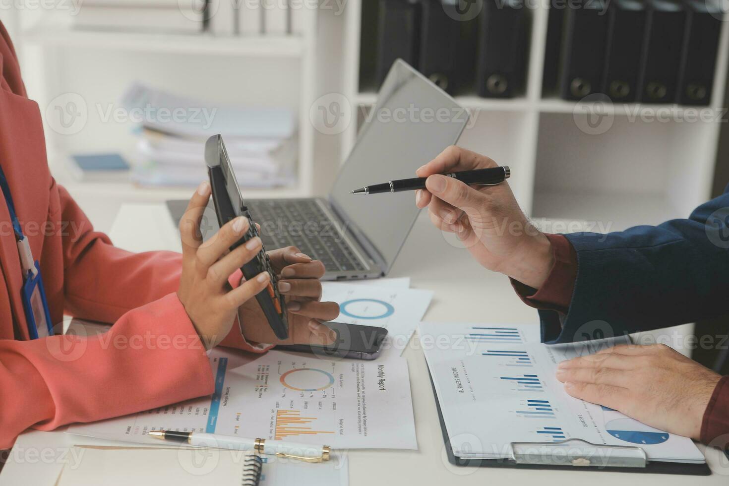 Close up Business woman using calculator and laptop for do math finance on wooden desk, tax, accounting, statistics and analytical research concept photo