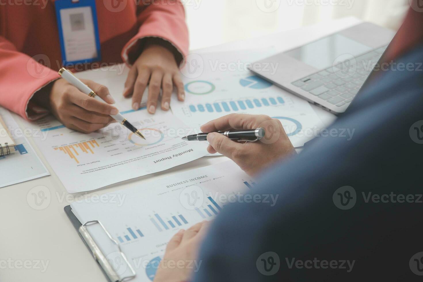 Close up Business woman using calculator and laptop for do math finance on wooden desk, tax, accounting, statistics and analytical research concept photo