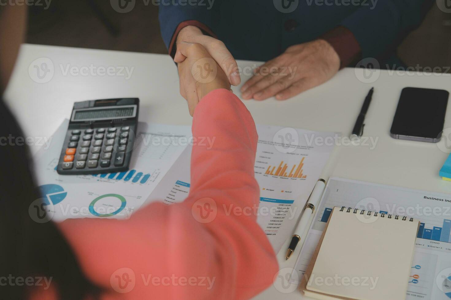 Close up Business woman using calculator and laptop for do math finance on wooden desk, tax, accounting, statistics and analytical research concept photo