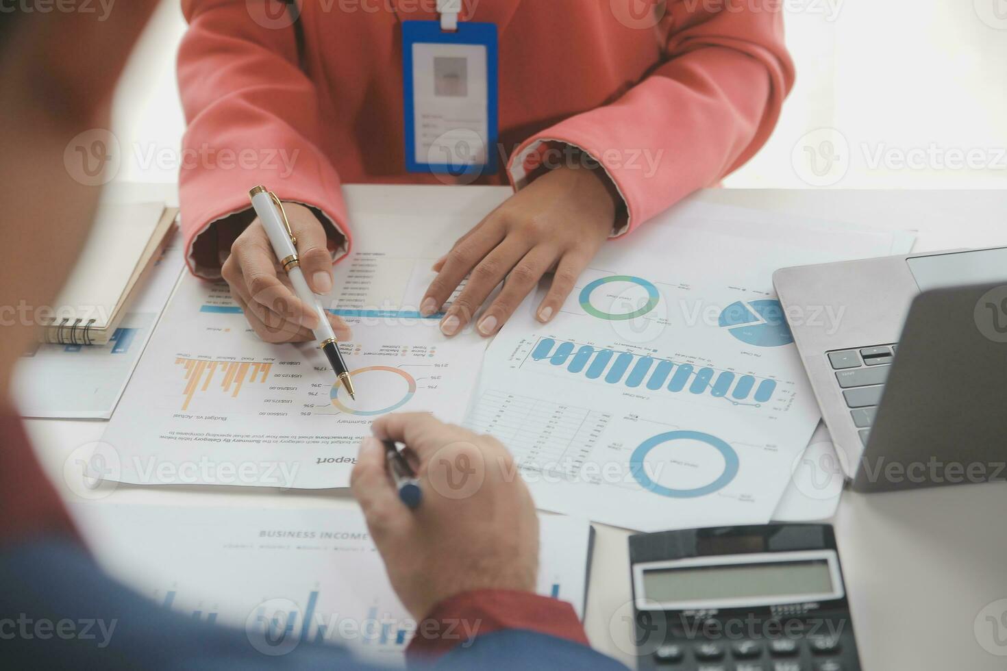 Close up Business woman using calculator and laptop for do math finance on wooden desk, tax, accounting, statistics and analytical research concept photo