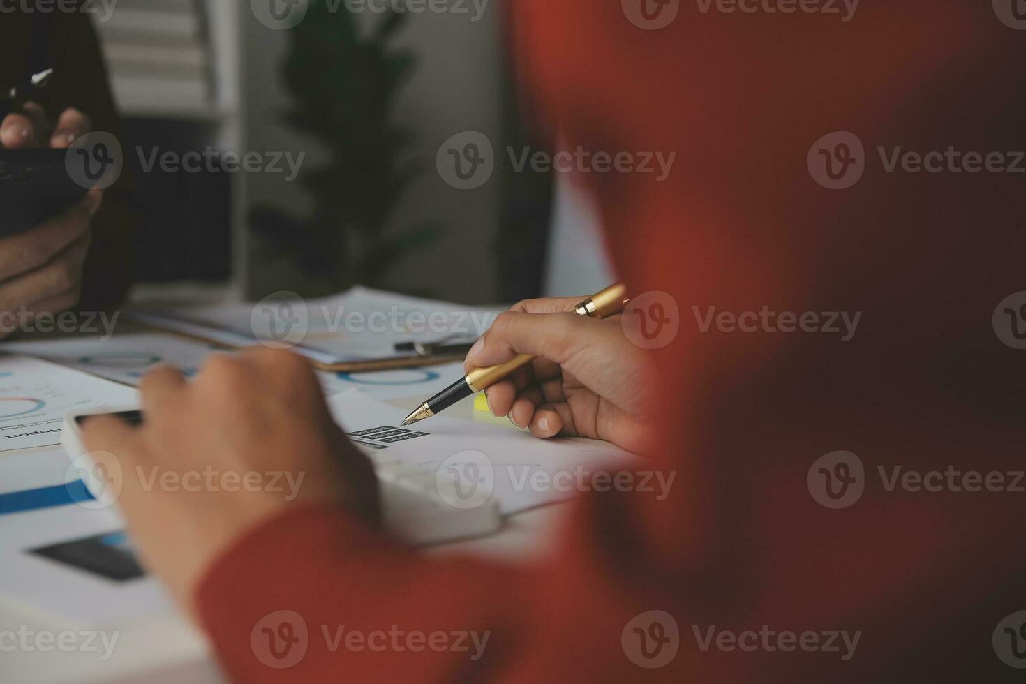 Close up Business woman using calculator and laptop for do math finance on wooden desk, tax, accounting, statistics and analytical research concept photo