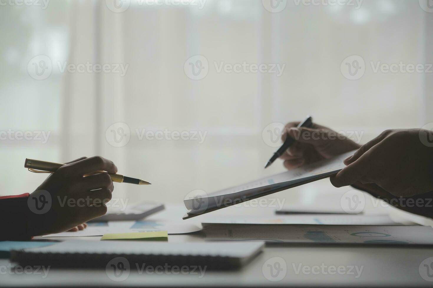 Close up Business woman using calculator and laptop for do math finance on wooden desk, tax, accounting, statistics and analytical research concept photo