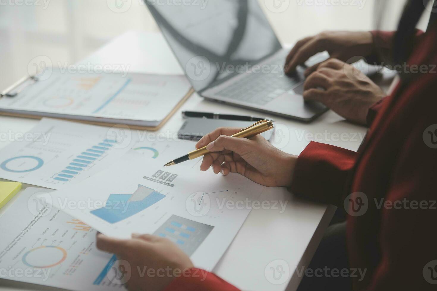 Close up Business woman using calculator and laptop for do math finance on wooden desk, tax, accounting, statistics and analytical research concept photo