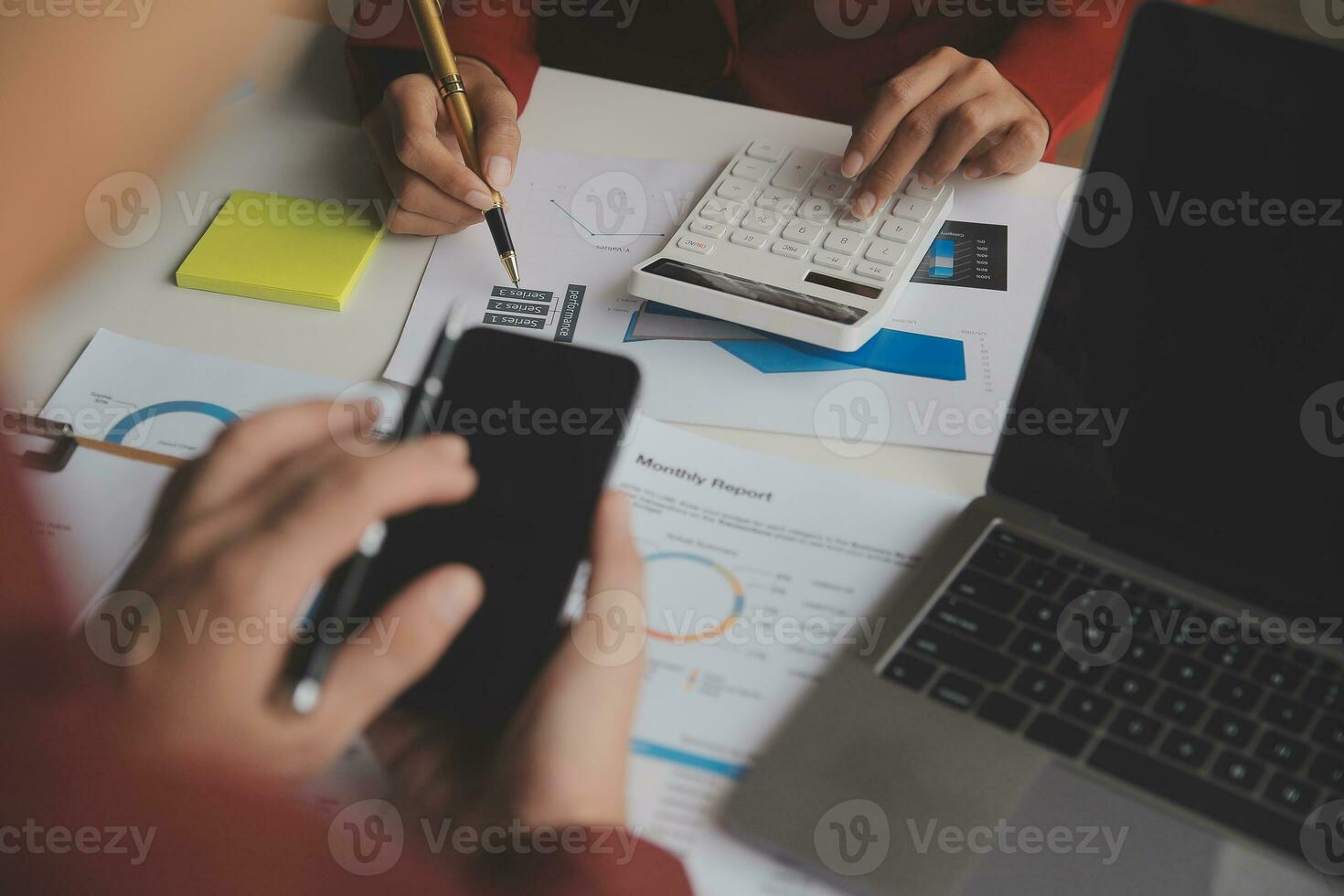 Close up Business woman using calculator and laptop for do math finance on wooden desk, tax, accounting, statistics and analytical research concept photo