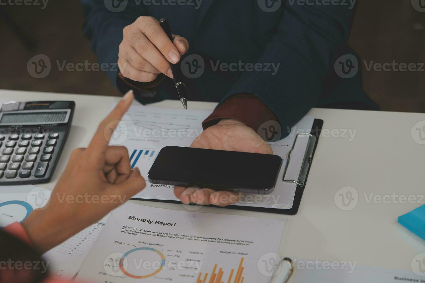 Close up Business woman using calculator and laptop for do math finance on wooden desk, tax, accounting, statistics and analytical research concept photo