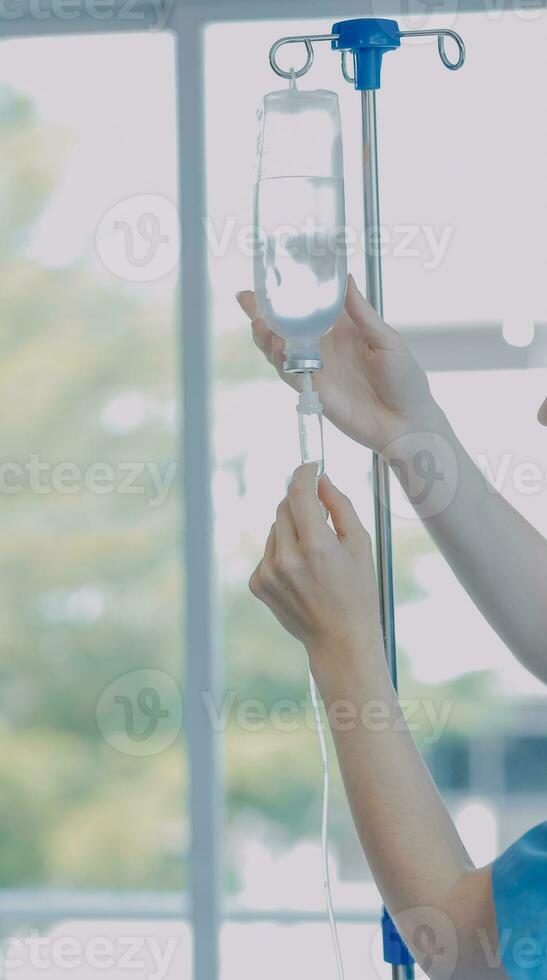 Women Asian doctors hold the patient hand and encourage and provide medical advice While checking the patient health in bed. Concept of Care and compassion, antenatal care, Threatened abortion photo