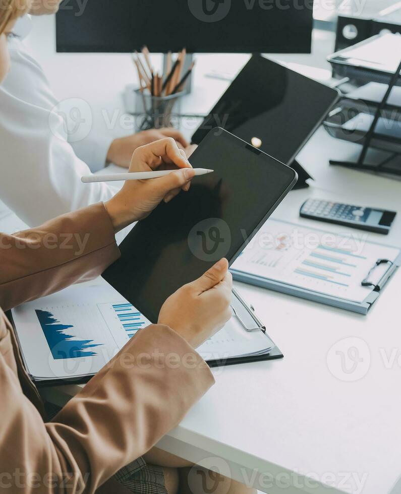 Team of business people working together in the meeting room office, teamwork background charts and graphs banner, double exposure successful teamwork,business planning concept. photo