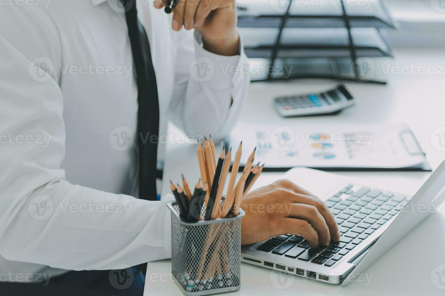 Close up of Business team analyzing income charts and graphs with modern laptop computer. Business analysis and strategy concept. photo