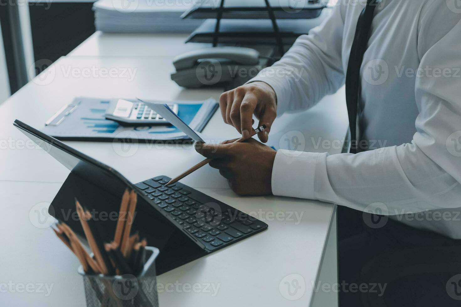 Close up of Business team analyzing income charts and graphs with modern laptop computer. Business analysis and strategy concept. photo