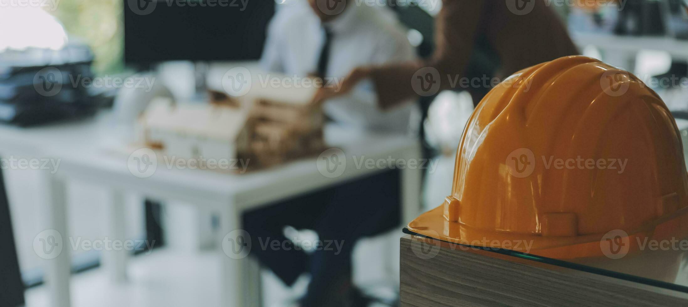 Construction and structure concept of Engineer or architect meeting for project working with partner and engineering tools on model building and blueprint in working site, contract for both companies. photo
