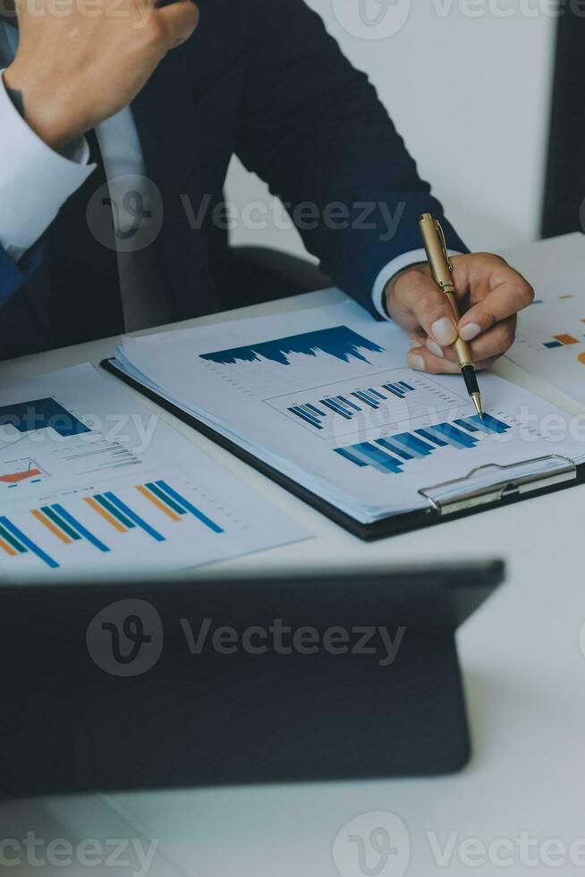 Team of business people working together in the meeting room office, teamwork background charts and graphs banner, double exposure successful teamwork,business planning concept. photo