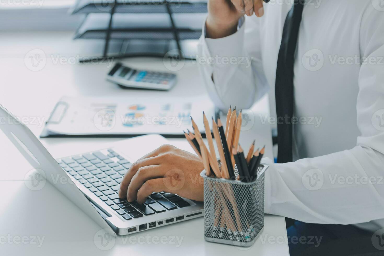 Close up of Business team analyzing income charts and graphs with modern laptop computer. Business analysis and strategy concept. photo