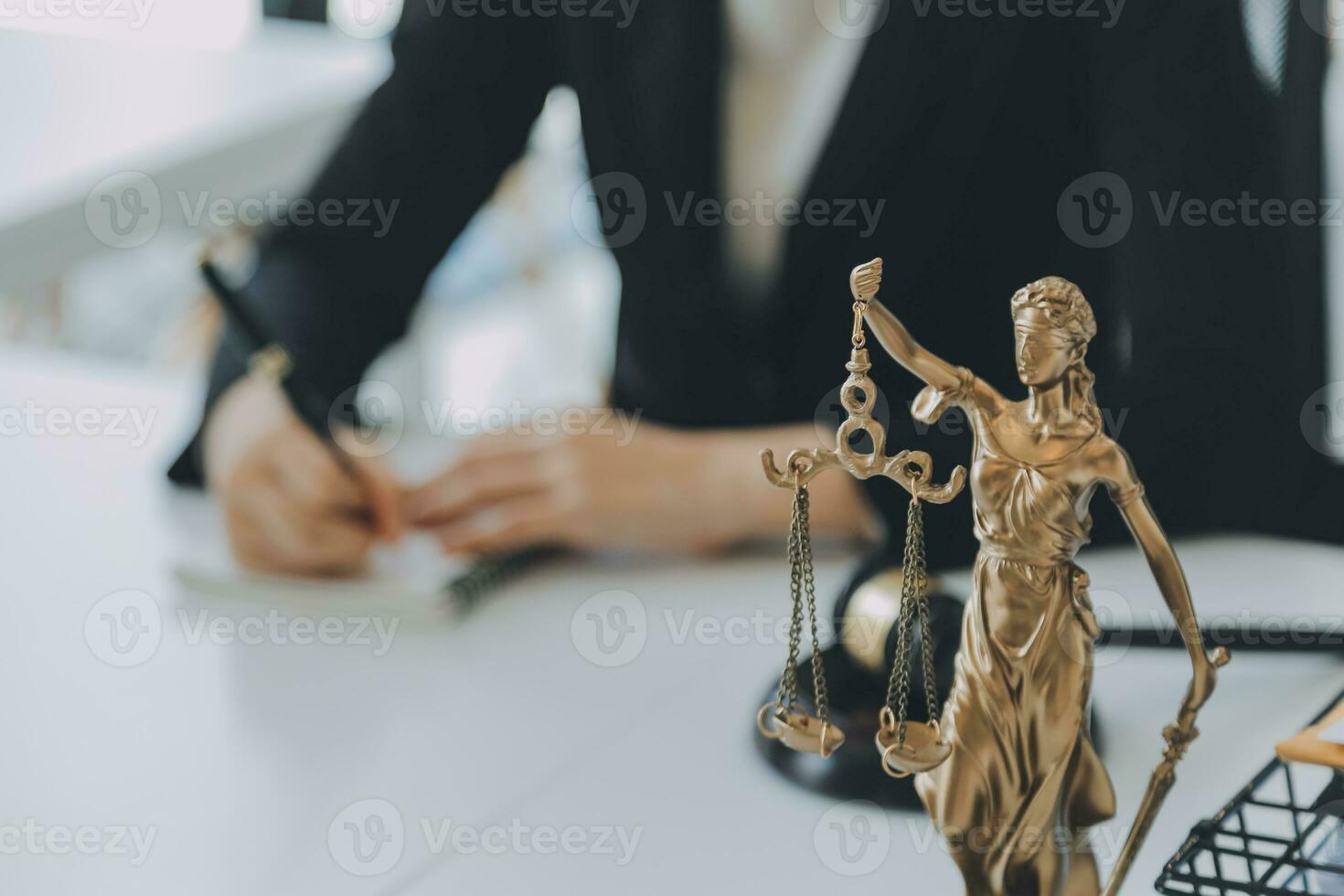 Judge gavel with Justice lawyers having team meeting at law firm in background. Concepts of law. photo