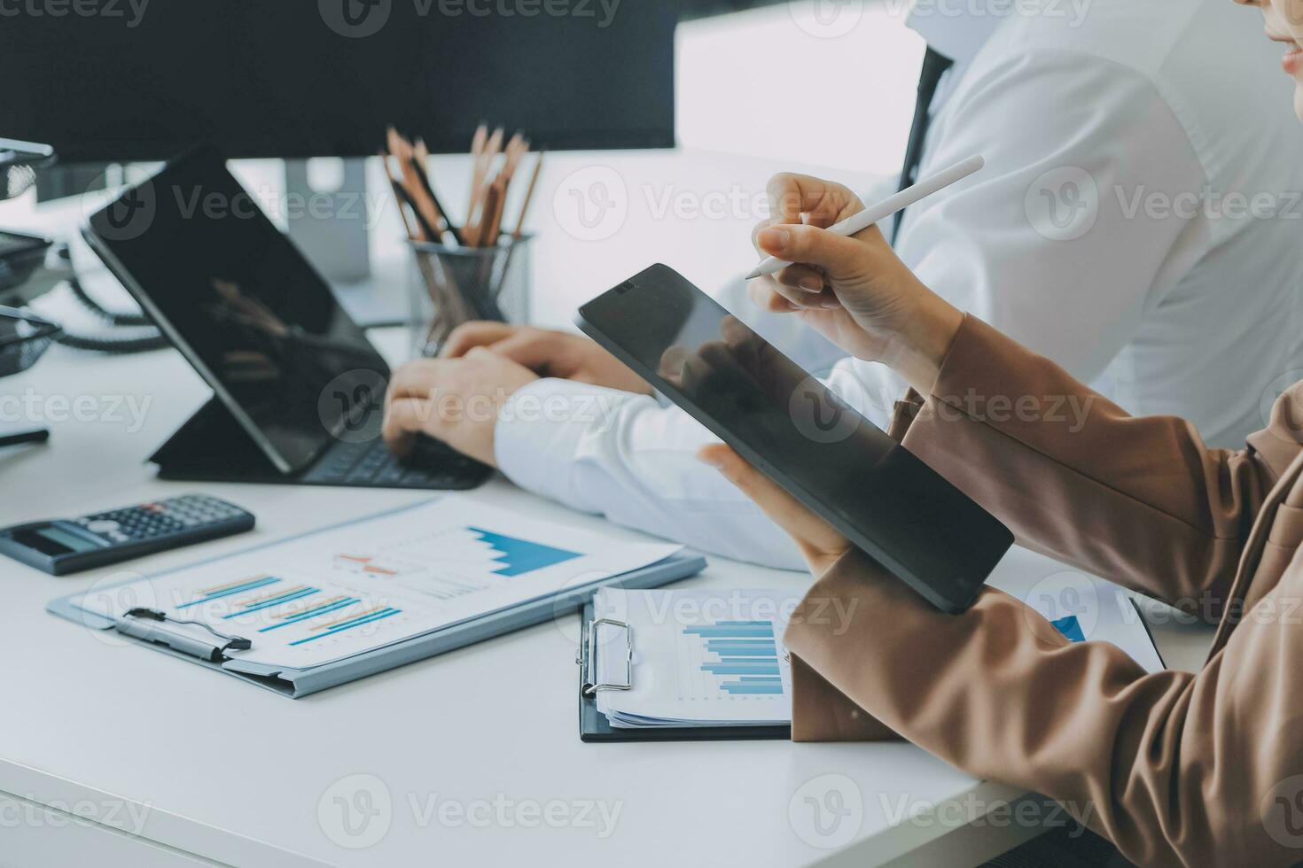 Team of business people working together in the meeting room office, teamwork background charts and graphs banner, double exposure successful teamwork,business planning concept. photo