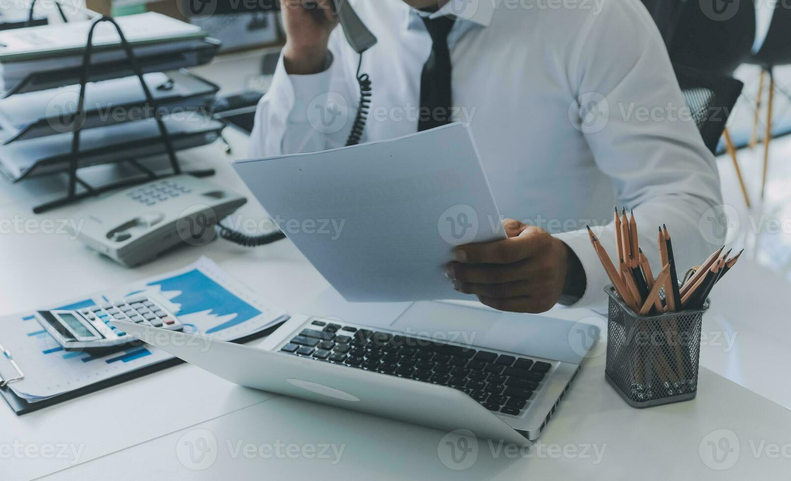 Close up of Business team analyzing income charts and graphs with modern laptop computer. Business analysis and strategy concept. photo