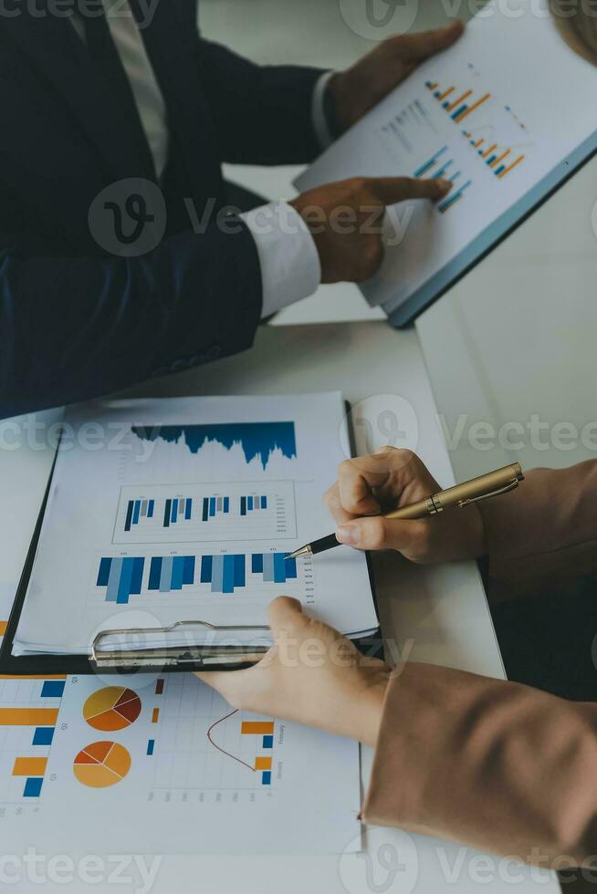 Team of business people working together in the meeting room office, teamwork background charts and graphs banner, double exposure successful teamwork,business planning concept. photo