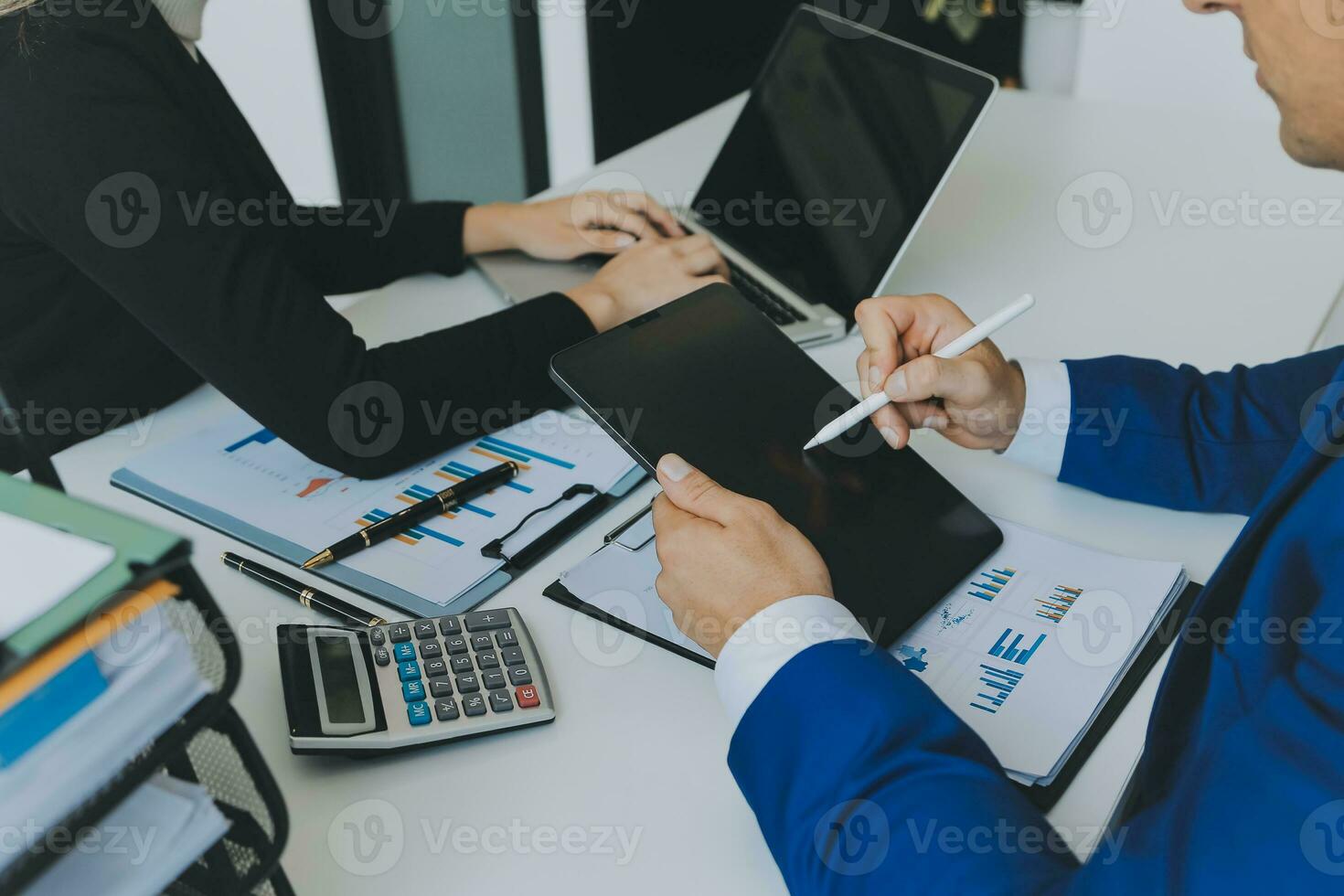 Close up of Business team analyzing income charts and graphs with modern laptop computer. Business analysis and strategy concept. photo