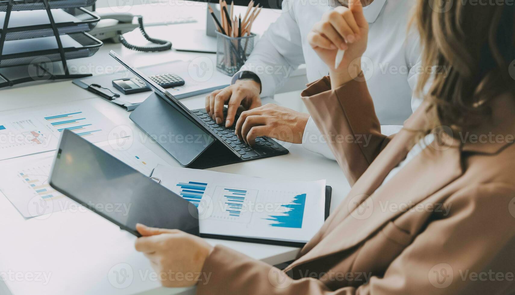 Team of business people working together in the meeting room office, teamwork background charts and graphs banner, double exposure successful teamwork,business planning concept. photo