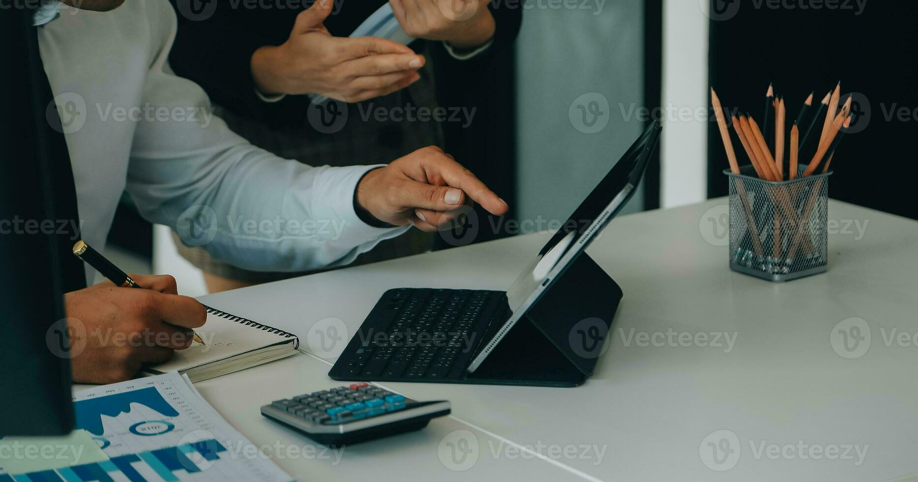 Close up of Business team analyzing income charts and graphs with modern laptop computer. Business analysis and strategy concept. photo