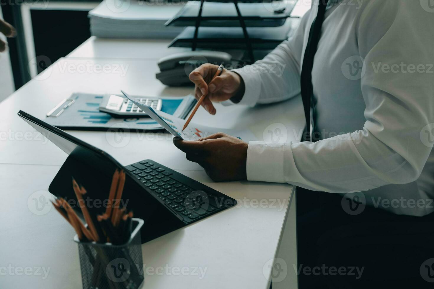Close up of Business team analyzing income charts and graphs with modern laptop computer. Business analysis and strategy concept. photo