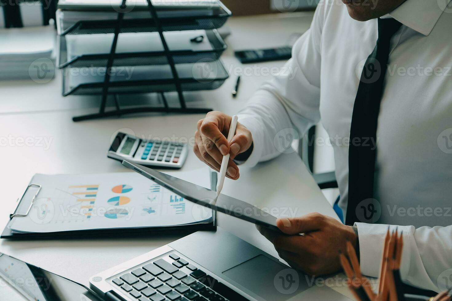 Close up of Business team analyzing income charts and graphs with modern laptop computer. Business analysis and strategy concept. photo