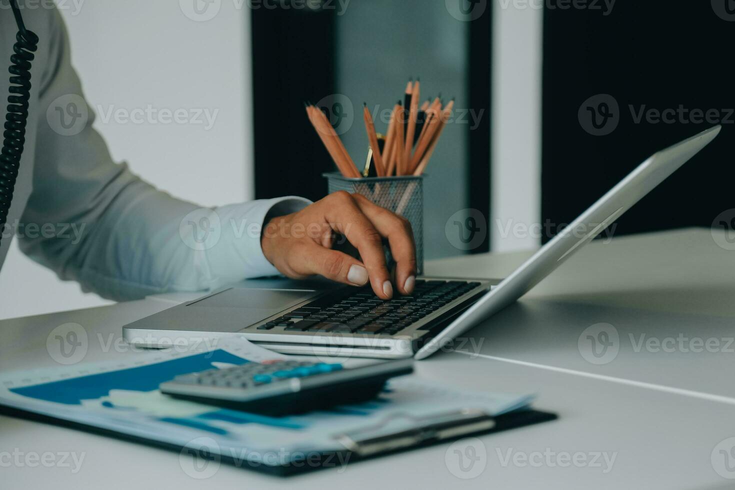 Close up of Business team analyzing income charts and graphs with modern laptop computer. Business analysis and strategy concept. photo