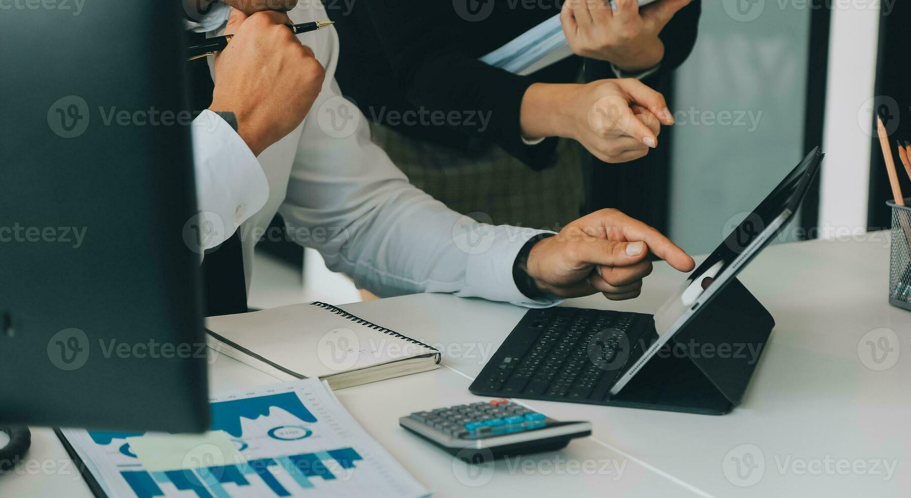 Close up of Business team analyzing income charts and graphs with modern laptop computer. Business analysis and strategy concept. photo