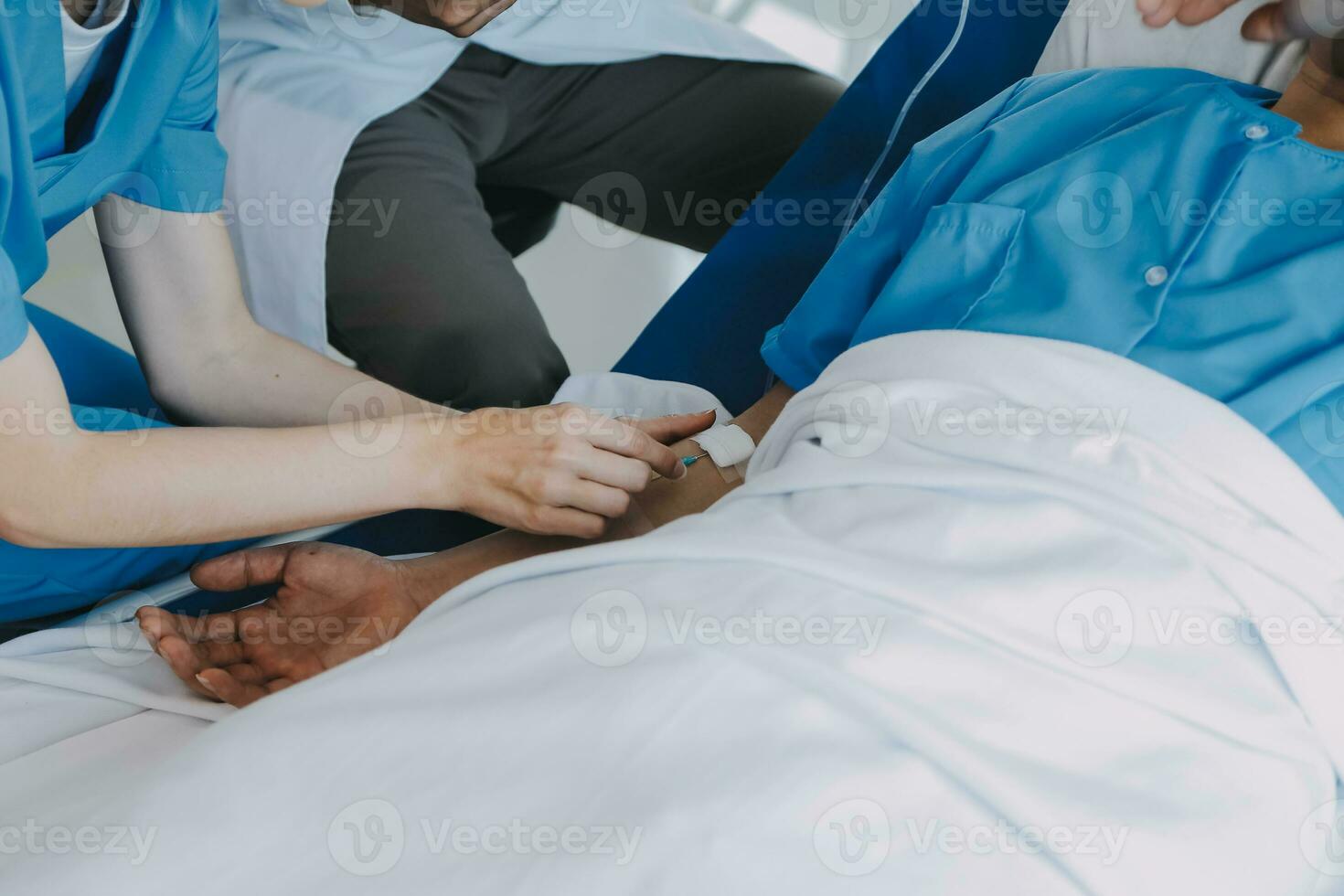 Women Asian doctors hold the patient hand and encourage and provide medical advice While checking the patient health in bed. Concept of Care and compassion, antenatal care, Threatened abortion photo