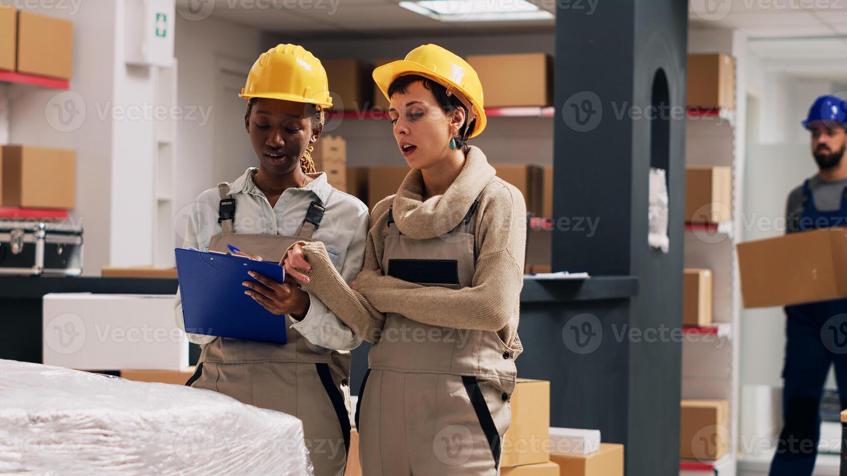 Two supervisors counting boxes of stock merchandise in storage room, looking at goods on depot shelves. Diverse people planning order shipment in warehouse, checking cargo products. photo