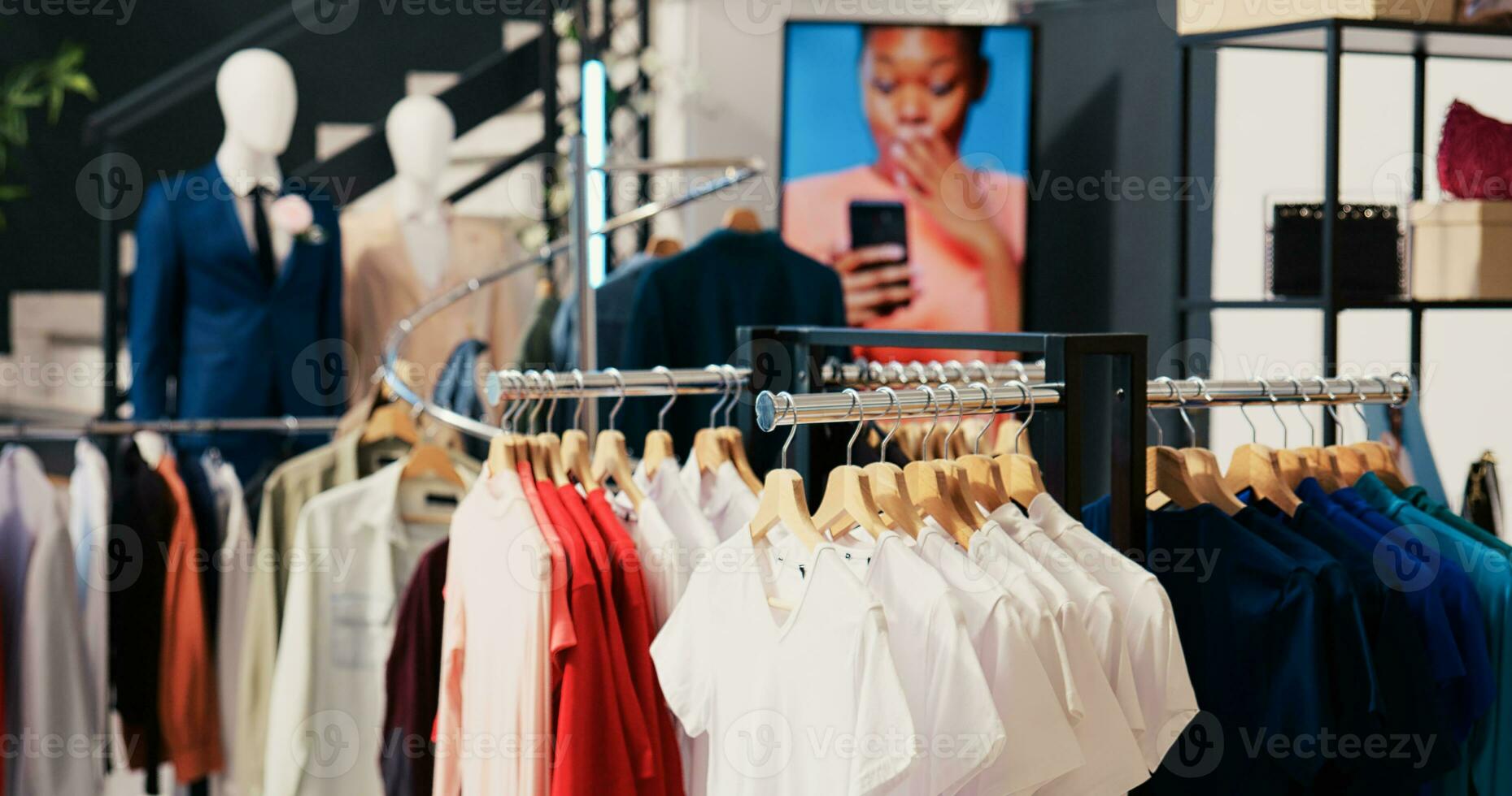 Empty clothing store in shopping mall, new fashion collection on shelf.  Fashionable clothes on hangers and racks, modern boutique filled with  merchandise and accessories at sale for customers 34139197 Stock Photo at