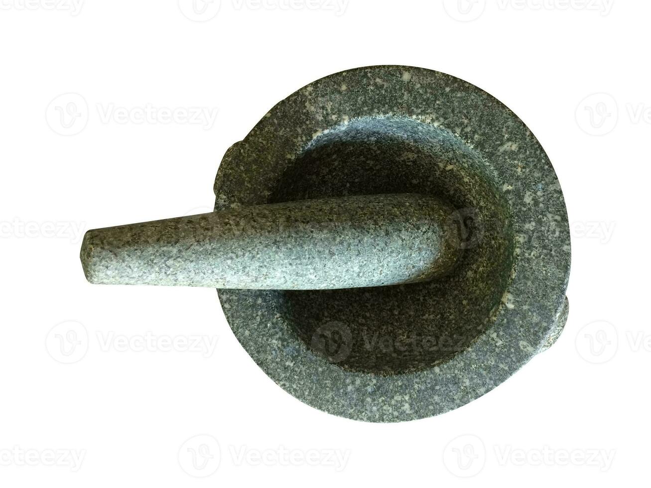 A mortar made of stone with a pestle for pounding spices. Thai curry paste Asians have it in the kitchen photo