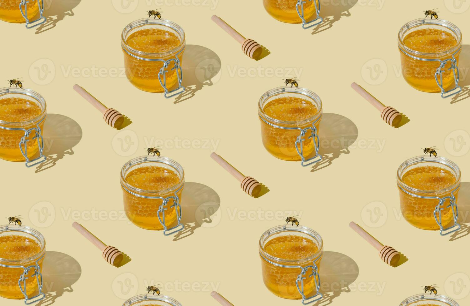 Creative pattern made with jar full of natural honey and honeycombs, honey bee and honey dipper on light beige background. Minimal nature concept. Trendy healthy food idea. Honey aesthetic background. photo