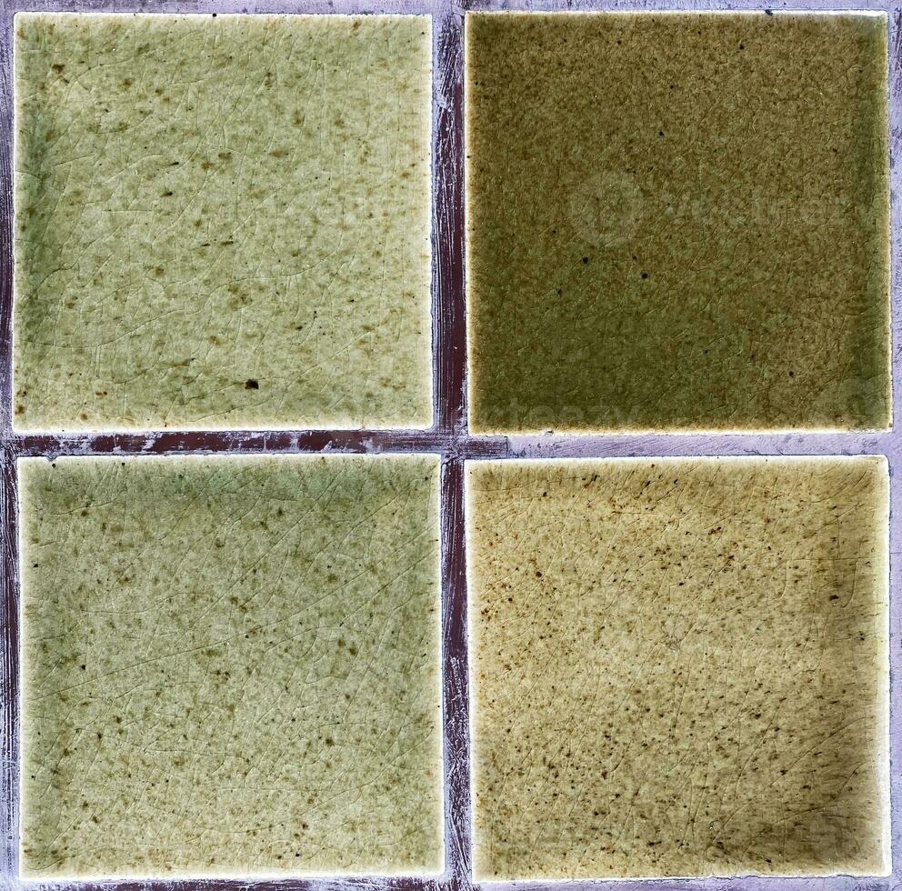 thai clay ceramic tiles green color with crack texture background. material for architecture interior or exterior decoration. photo